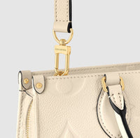 OnTheGo East West Monogram Reverse Canvas Daily Stuff