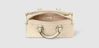 OnTheGo East West Monogram Reverse Canvas Daily Stuff